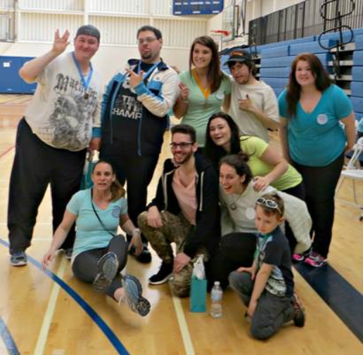 Members of the EPW program pose for a photo at the gym